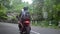 Couple drive motorcycle through tropical country-side, rural way, travel concept