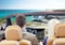 Couple driving in cabriolet car over sea shore