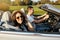 Couple driving cabriolet in summer