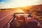 Couple Driving Convertable at Sunset