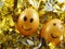 Couple of easter eggs with drawing happy smiling, on golden tuft