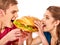 Couple eat fast food on hamburger eating competition