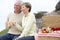 Couple Eating An Al Fresco Meal At The Beach