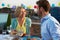 Couple Eating Evening Meal On Rooftop Terrace