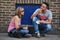 A couple eating some snacks on the street