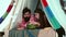Couple eating watermelon in tent camping. Portrait of passionate lovers in cozy tent for couple in love on nature