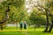 Couple of elderly gardeners walking.