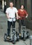 Couple with electrkc bikes in vacation on city street
