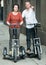 Couple with electrkc bikes in vacation on city street