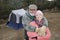 Couple Embracing In Front Of Camping Tent