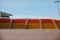 A couple in empty outdoors concrete bleachers