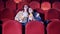 A couple are enjoying a cinema movie together