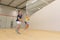 Couple enjoying game squash in squash court