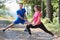 couple enjoying in a healthy lifestyle warming up and stretching before jogging