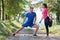 couple enjoying in a healthy lifestyle warming up and stretching before jogging