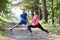 couple enjoying in a healthy lifestyle warming up and stretching before jogging