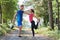 couple enjoying in a healthy lifestyle warming up and stretching before jogging