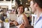 Couple Enjoying Lunch Date In Delicatessen Restaurant