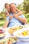 Couple Enjoying Meal In Garden