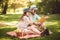 Couple enjoying picnic time outdoor reading book