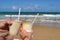 Couple enjoying pina coladas on the beach