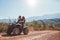 Couple enjoying a quad bike ride in countryside