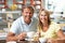 Couple Enjoying Slice Of Cake And Coffee In Cafe