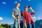 Couple enjoying view hiking in the alpine mountains