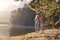 Couple Enjoying Walk By Lake On Family Hiking Adventure