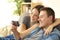 Couple enjoying watching media content in a phone