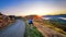 Couple enjoys beautiful Akaroa scenery near Christchurch in New Zealand. Romantic couple goes on road trip