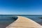 A couple enjoys a relaxing afternoon and the amazing views from the Infinite Bridge in Aarhus