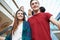 Couple On Escalator In Shopping Mall Together