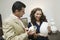 Couple Examining Vases in furniture shop