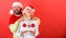 Couple excited hold christmas balls. Christmas miracle concept. Plastic surgery. Man santa hat hold balls christmas