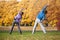 Couple exercising in park in fall