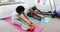 Couple exercising together on exercise mat 4k