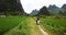 Couple exploring Yangshuo villages on the motorbike