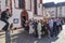 Couple with family poses for a marriage photo in front of Nicola