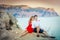 Couple family traveling together on cliff edge in Norway man and woman lifestyle concept summer vacations outdoor aerial