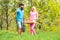 Couple of farmers walking in agricultural field. Portrait of pair of farms Working In Garden Together. Image of two