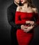 Couple Fashion Beauty, Woman in Red Dress and Embracing Man in Love