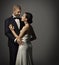 Couple Fashion Portrait, Embracing Man in Suit and Woman in Dress