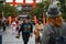 Couple fashionable dressed youth tourists walking with camera to temple Kyoto