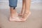 Couple feet on the beach