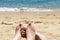 Couple feet on the beach, turquoise sea, love concept