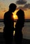 Couple figure with sunset scene