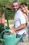 Couple filling up watering can