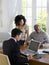 Couple With Financial Advisor At Table