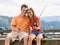 Couple fishing on pier